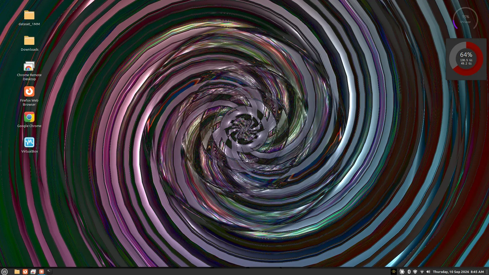 A Linux Mint desktop with the visuals playing behind the folder icons and the panel